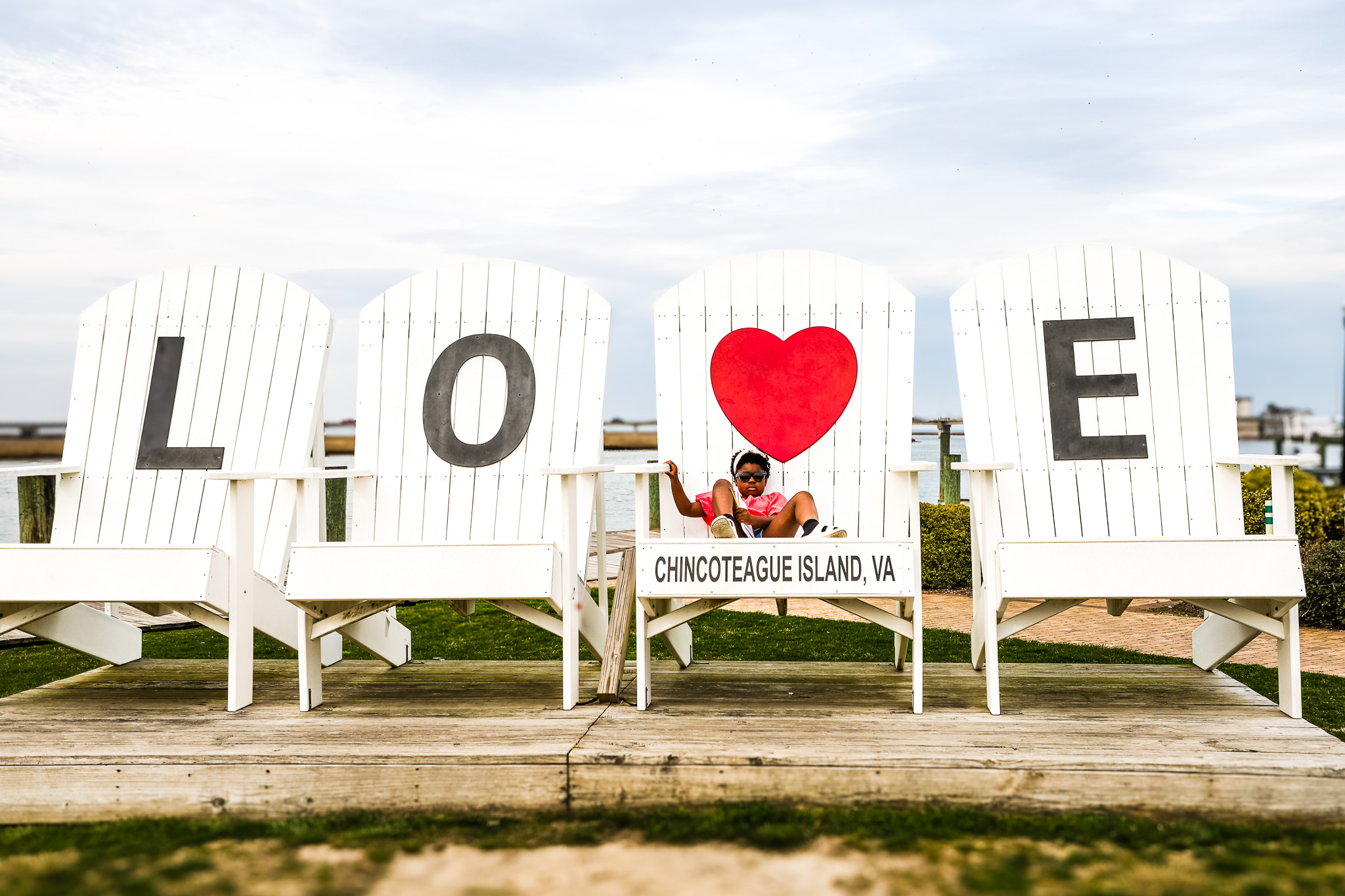 kid sitting in chair at chincoteague virginia